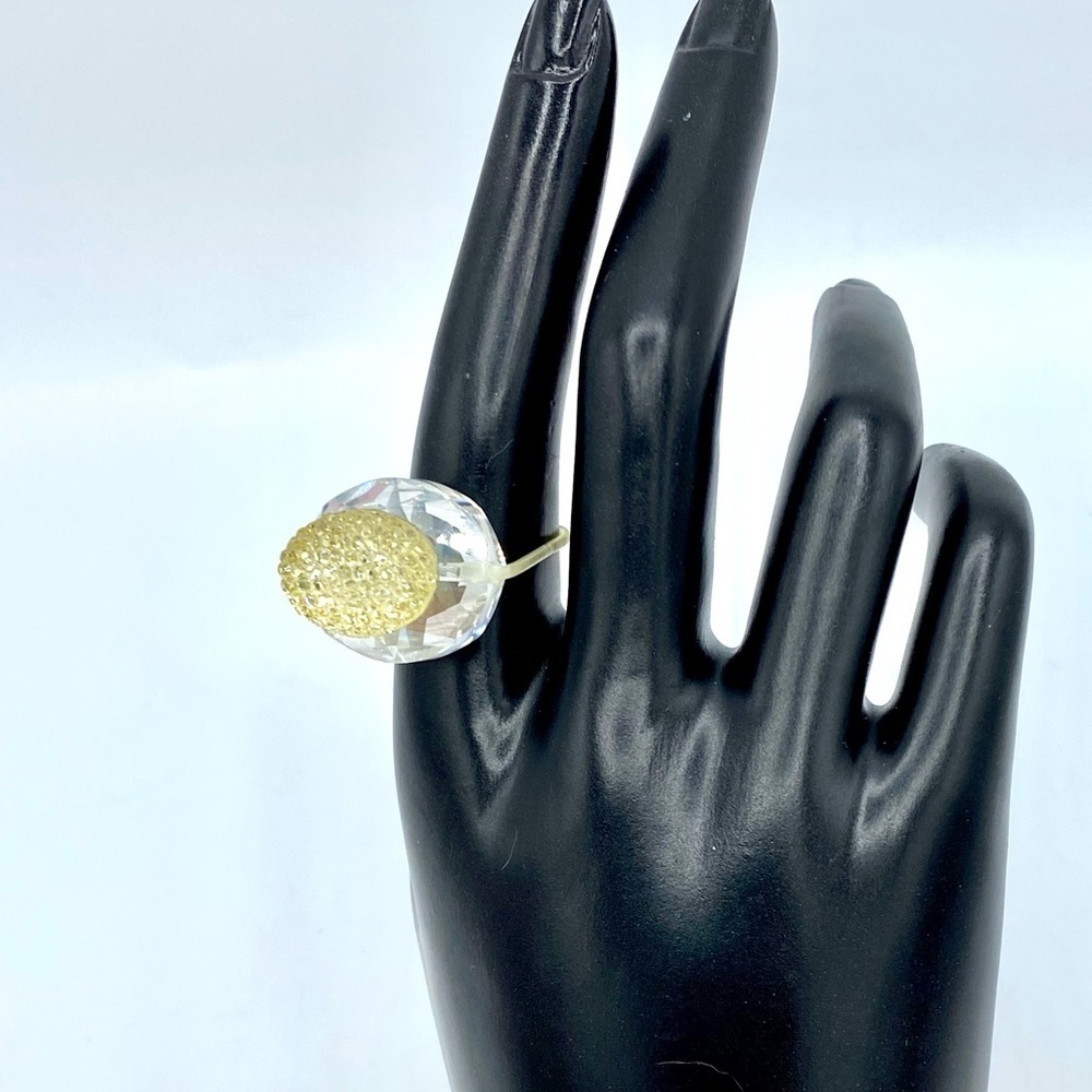 Pale yellow crystal ring I clear crystal setting with flexible band size 7